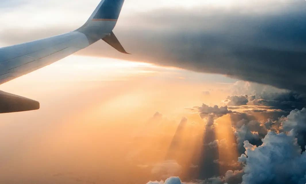 View from airplane window during sunset